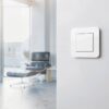 Gira E3 Pure White switch with Eames chair