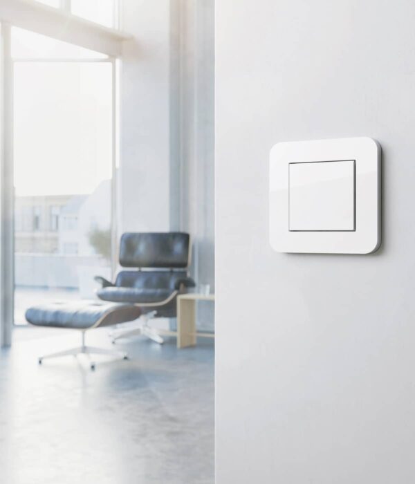 Gira E3 Pure White switch with Eames chair
